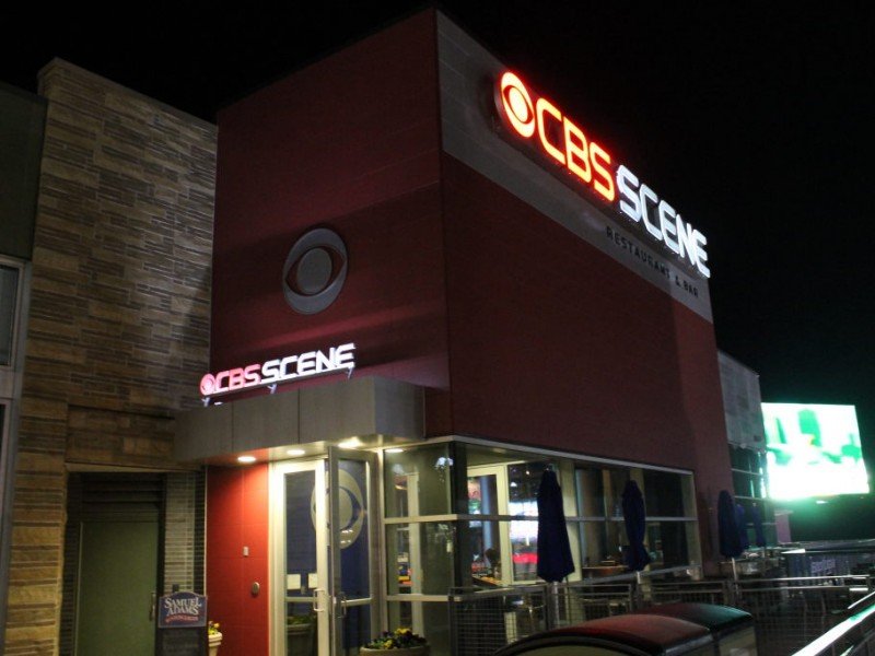 Exterior of CBS Scene entrance at Patriot Place at night - Foxboro, MA